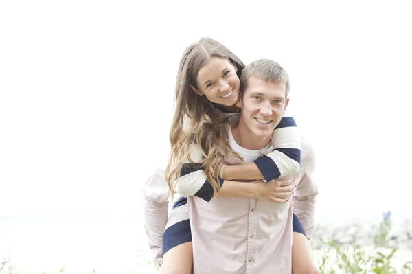 Young couple on the beach — Stock Photo, Image