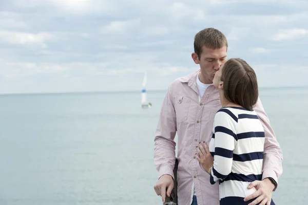 Young Caucasian couple at the pier — Stock Photo, Image