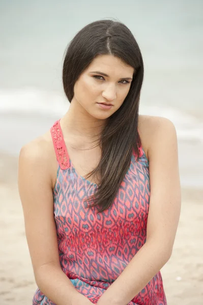 Female model sitting at the beach — Stock Photo, Image