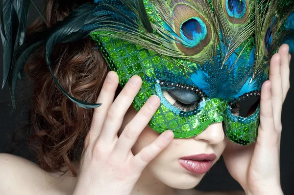 Attractive woman holding the mask Stock Photo