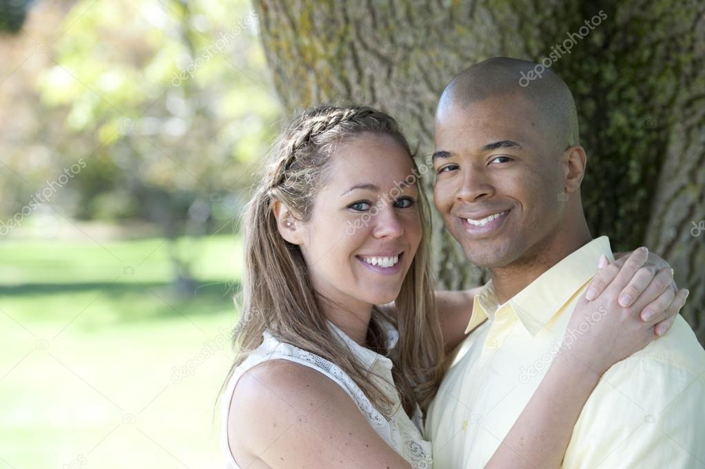 Young interracial couple in the park