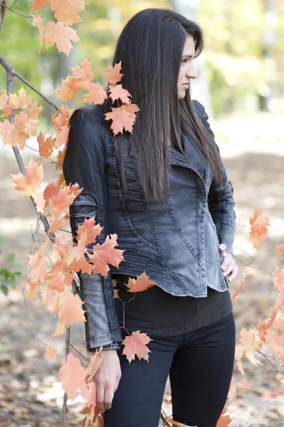 Young girl posing in a leather jacket