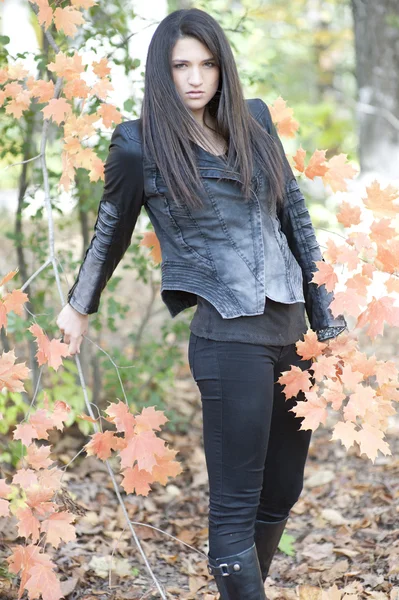 Young girl posing in a leather jacket — Stock Photo, Image