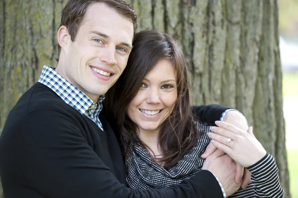 Attractive couple at a park — Stock Photo, Image