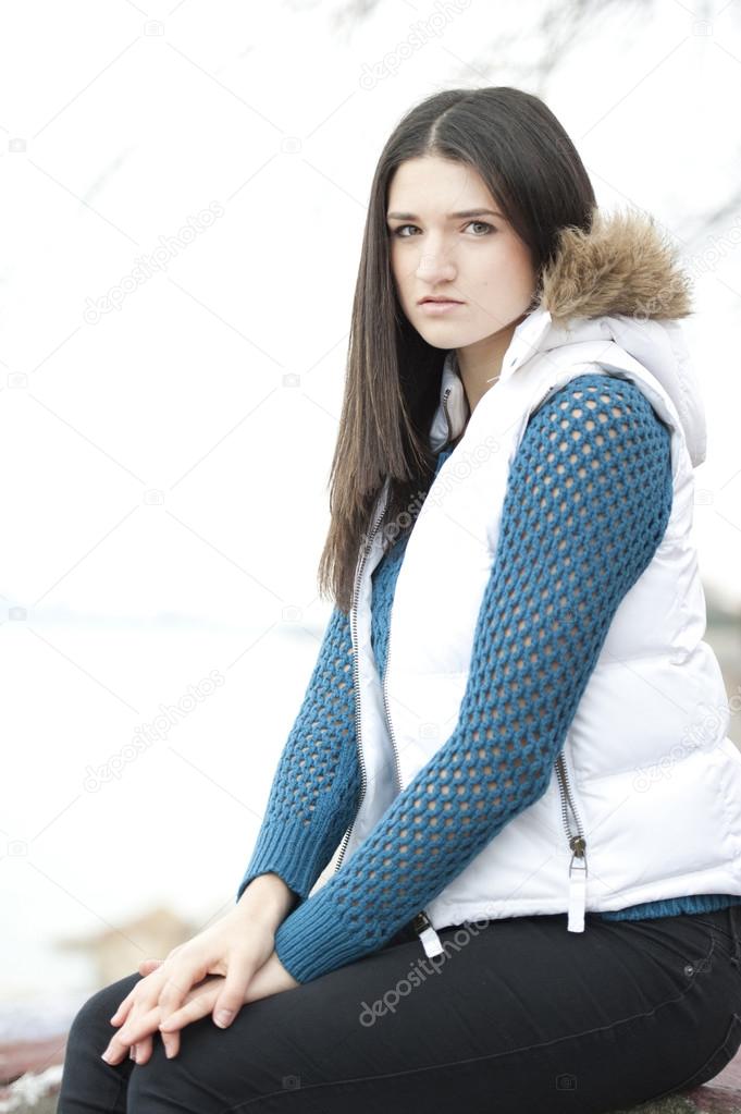 Fashionable teenage girl posing outdoors