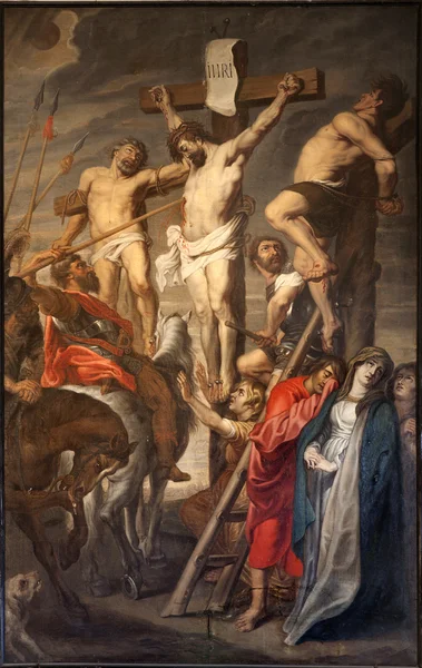 June 23: 2012年6月23日、ベルギーのゲントにある聖ペテロ教会のピーター・ポーウェル・ルーベンス(1619a.d.)による二つの泥棒の間の十字架上のキリスト. — ストック写真