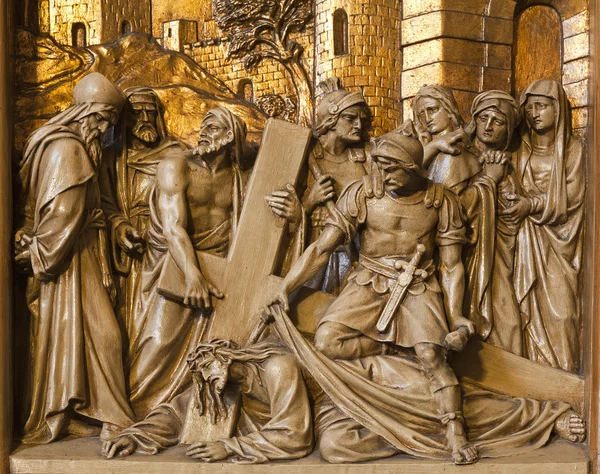 BRUSSELS - JUNE 24: Jesus falls under cross. Relief from Cross way in Saint Antoine church on June 24, 2012 in Brussels. — Stock Photo, Image