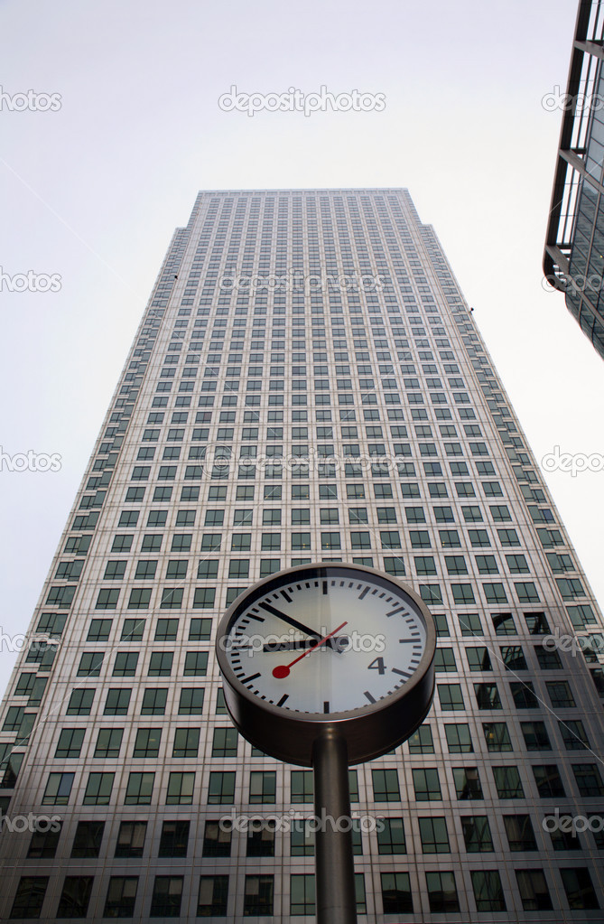 London - clock and facade of Canary Wharf Tower