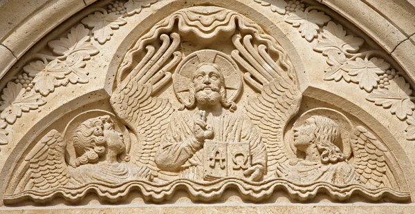 BUDAPEST - SEPTEMBER 22: Relief of Jesus the Pantocrator from west portal on gothic Church of Jak in Vajdahunyad castle on September 22, 2012 in Budapest. — Stok Foto