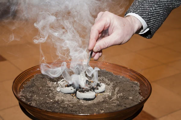 Hand by incense — Stock Photo, Image