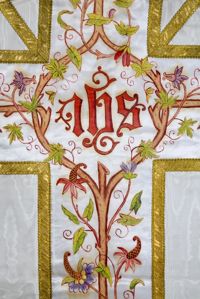 Cruz - detalhe do vestuário católico pintado — Fotografia de Stock