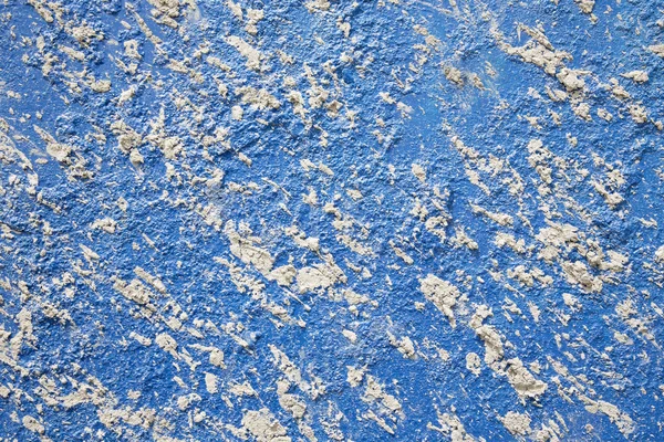 Trockene Kleckse an der blauen Wand — Stockfoto