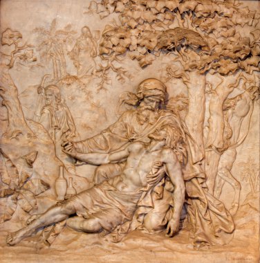 ANTWERP, BELGIUM - SEPTEMBER 5: Marble relief of merciful Samaritan scene in St. Charles Borromeo church on September 5, 2013 in Antwerp, Belgium clipart