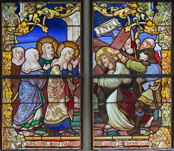 MECHELEN, BELGIUM - SEPTEMBER 6: Jesus under cross and his mother from windowpane of St. Rumbold's cathedral on Sepetember 6, 2013 in Mechelen, Belgium. — Stock Photo, Image