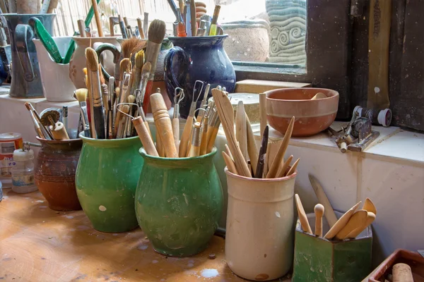 Detail from pottery work room - brushes and tools — Stock Photo, Image