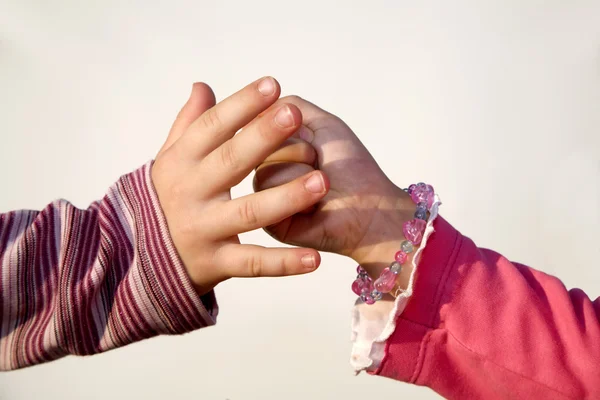 Hands of little children by the play — Stock Photo, Image