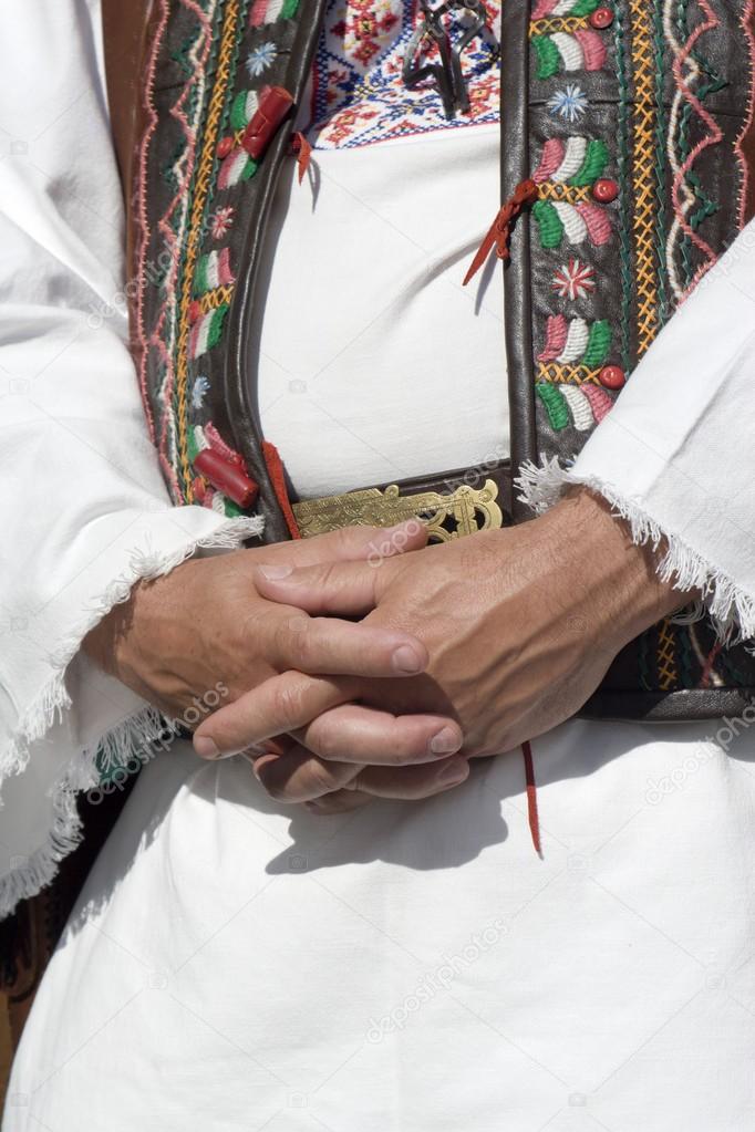Hands of man in folklore castume - slovakia
