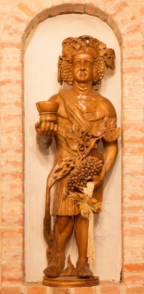 BRATISLAVA, SLOVAKIA - JANUARY 23, 2014: Bakchus carved statue from interior of wine cellar of great Slovak producer. — Stock Photo, Image