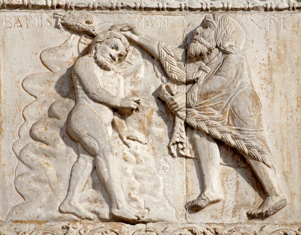 VERONA - JANUARY 27: Baptism of Jesus from romanesque Basilica San Zeno. Relief is work of the sculptor Nicholaus and his workshop on January 27, 2013 in Verona, Italy. — Stock Photo, Image