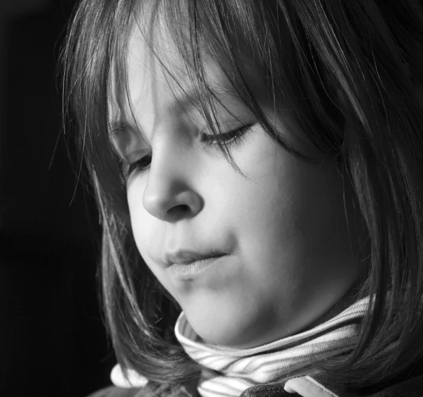 Portrait of little girl in the light — Stock Photo, Image