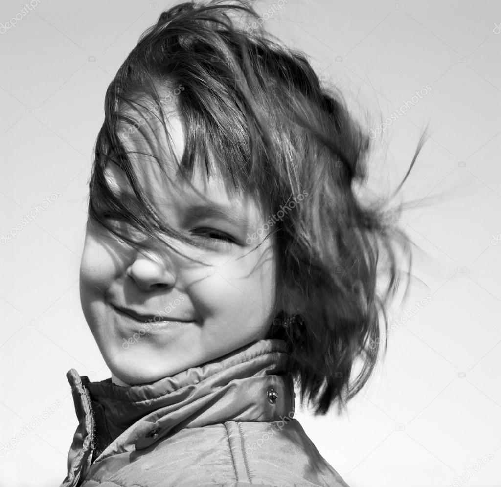 Portrait of little girl in the wind