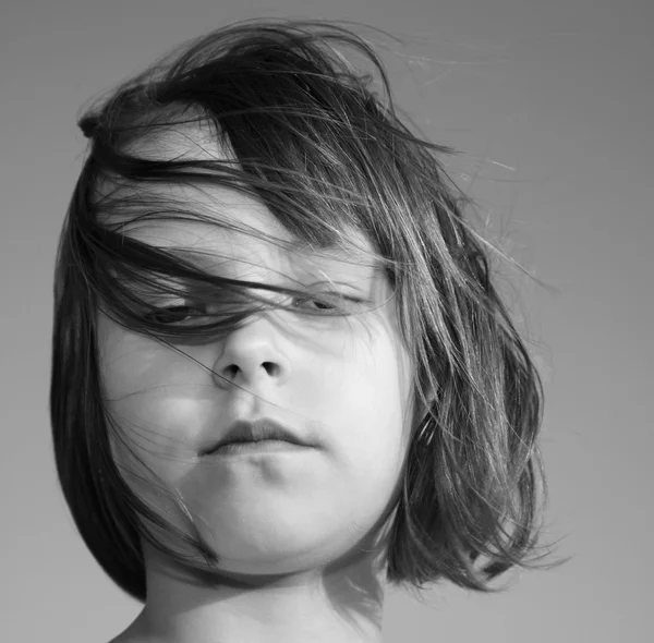 Sadness of little girl in the wind - portrait — Stock Photo, Image