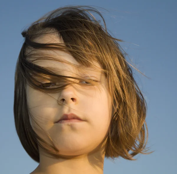 Sadness of little girl in the wind - portrait — Stock Photo, Image