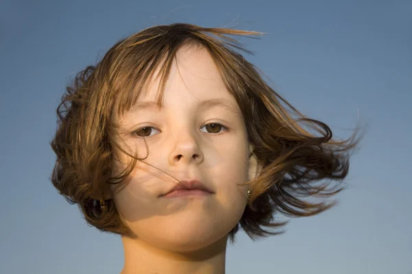 Portrait of little girl - sear in the wind — Stock Photo, Image