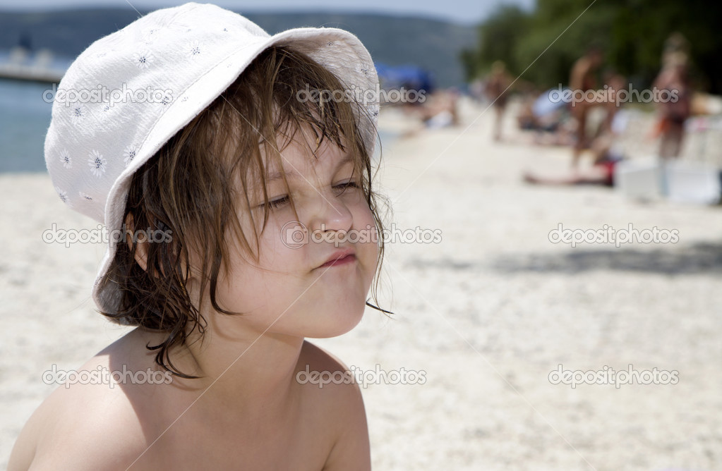 Portrait ot little girl on holiday in croatia - beach