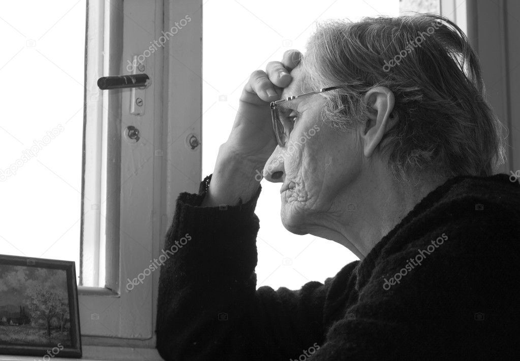 Old woman by prayer