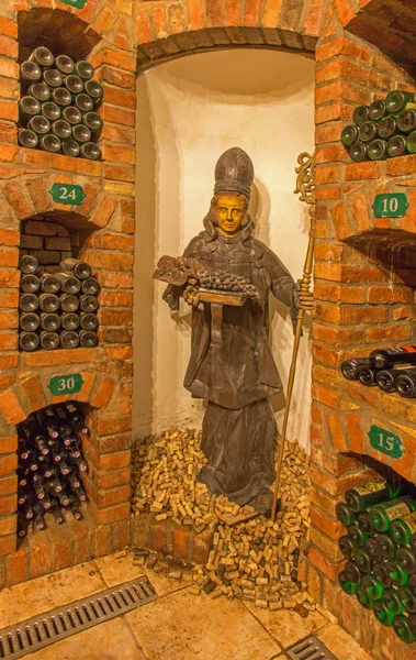 BRATISLAVA, SLOVAKIA - JANUARY 23, 2014: Saint Urban carved statue from interior of wine cellar of great Slovak producer. — Stock Photo, Image