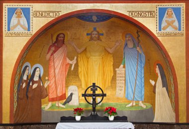 VIENNA, AUSTRIA - FEBRUARY 17, 2014: Jesus with the Moses and Eliah fresco by P. Verkade (1927) from side altar in Carmelites church in Dobling. clipart