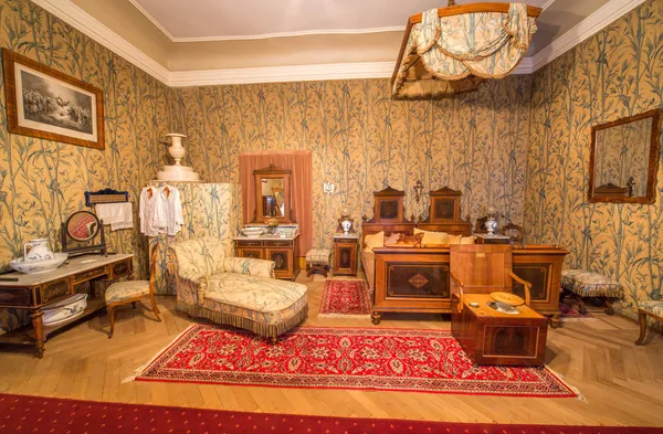 SAINT ANTON, SLOVAKIA - FEBRUARY 27, 2014: Bedroom of guests. Furniture from 19. cent in palace Saint Anton. — Stock Photo, Image