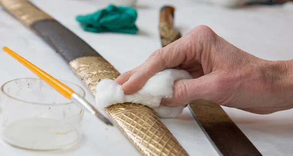 Restoration of old Turkish sword - detail of hand at work — Stock Photo, Image