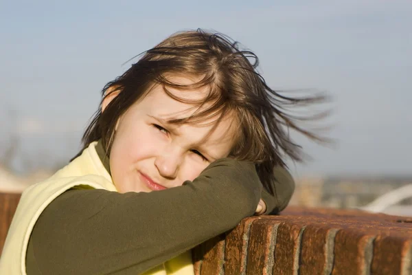 Little girl sorrow in the wind — Stock Photo, Image