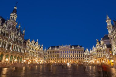 BRUSSELS, BELGIUM - JUNE 14, 2014: The main square and Ggrand palace in evening. Grote Markt. clipart