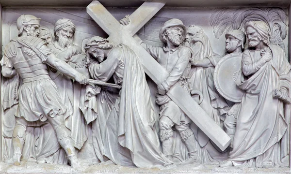 MECHELEN, BELGIUM - JUNE 14, 2014: Stone relief Simon of Cyrene help Jesus to carry his cross  in church Our Lady across de Dyle. — Stock Photo, Image