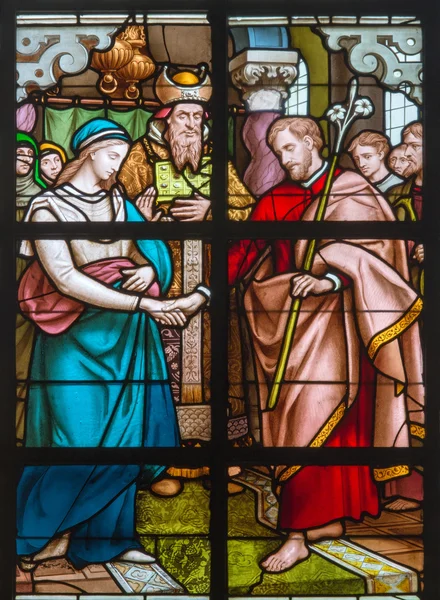 MECHELEN, BELGIUM - JUNE 14, 2014: The Espousals of Virgin Mary and st. Joseph scene from the windowpane in st. Johns church or Janskerk from begin of 20. cent.