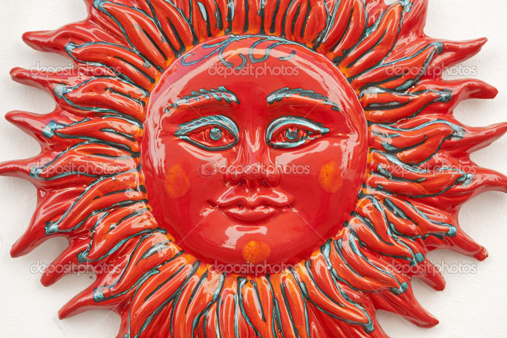 Monreale - detail of red ceramic sun from market