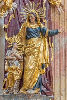VIENNA, AUSTRIA - FEBRUARY 17, 2014: Polychrome baroque statue of st. Ann in st. Annes church. clipart