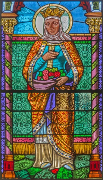 ROZNAVA, ESLOVAQUIA - 19 DE ABRIL DE 2014: Santa Isabel de Hungría desde el cristal de la ventana desde 19. cent. en la catedral . — Foto de Stock