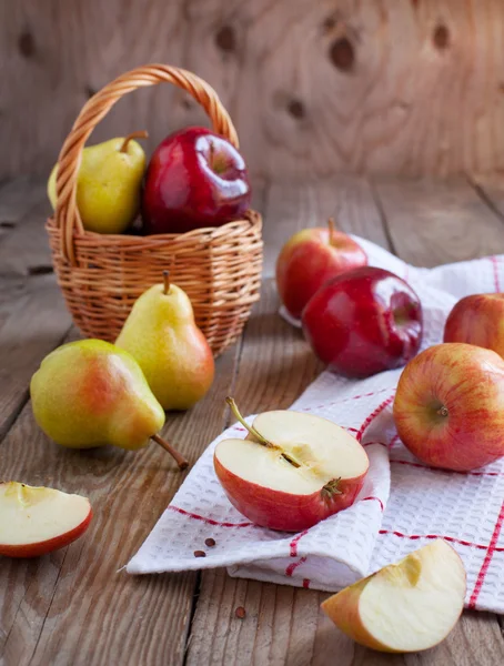 Fresh ripe pears and apples on wooden table. Selective focus — Stock Photo, Image