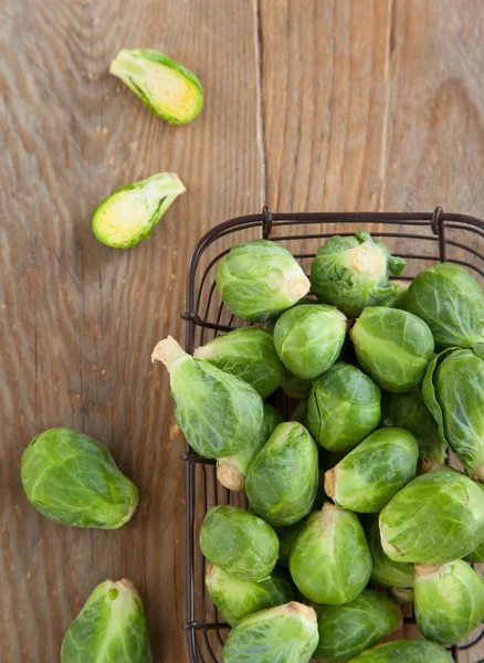 Brussels sprouts on wooden table — Stock Photo, Image