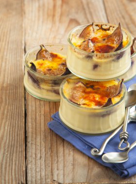 Creme brulee - Brulled figs and honey. Selective focus. clipart