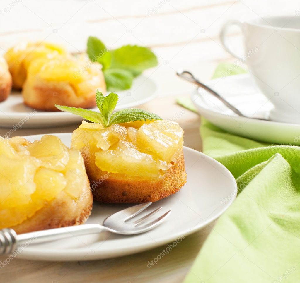 Individual pineapple upside-down cakes. Selective focus