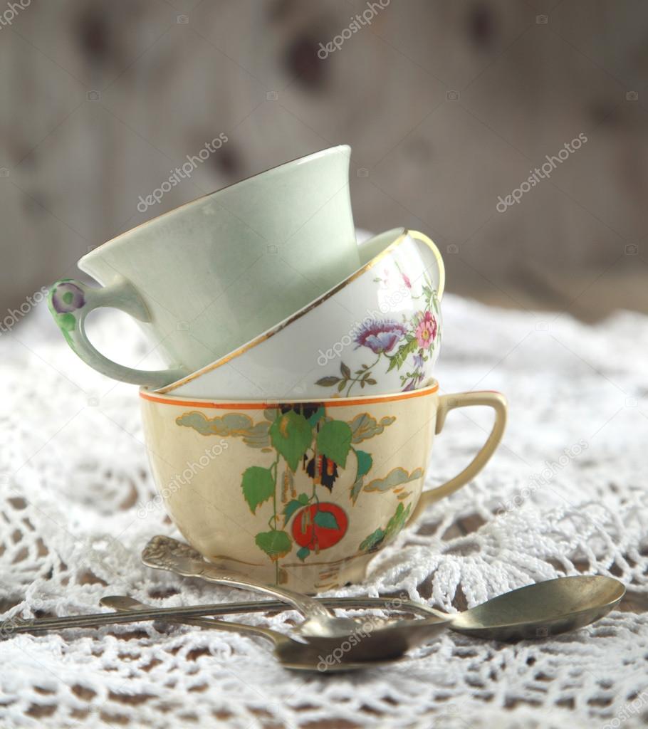 Antique tea cups and spoons