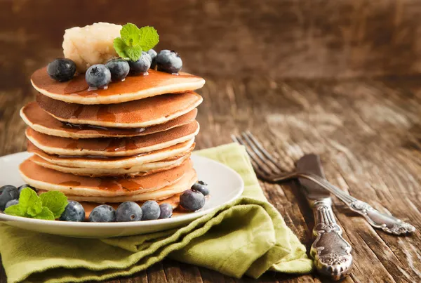 Stack of pancakes with fresh blueberry,maple butter and syrup — Stock Photo, Image