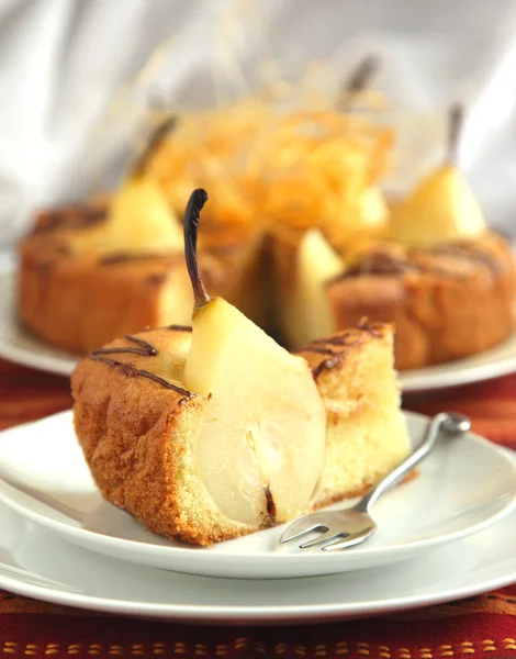 Piece of cake with pears with spun sugar strands — Stock Photo, Image