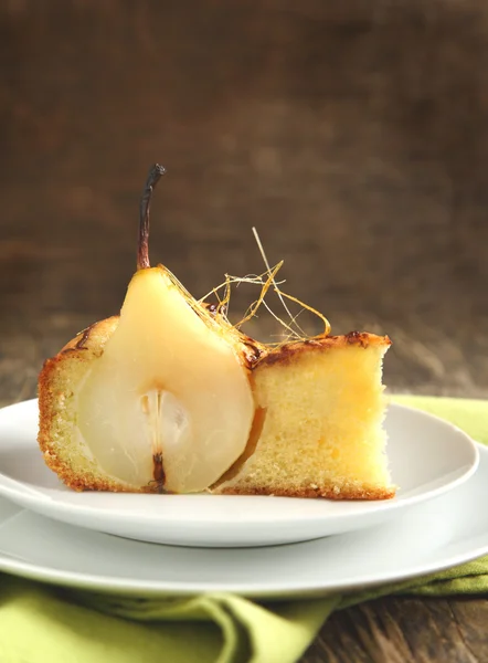 Piece of cake with pears with spun sugar strands — Stock Photo, Image