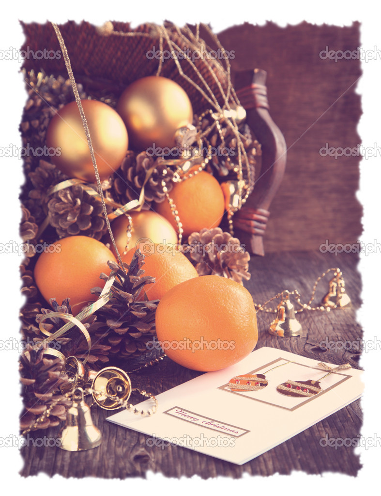 Christmas Card with Christmas decoration, oranges and pine cones